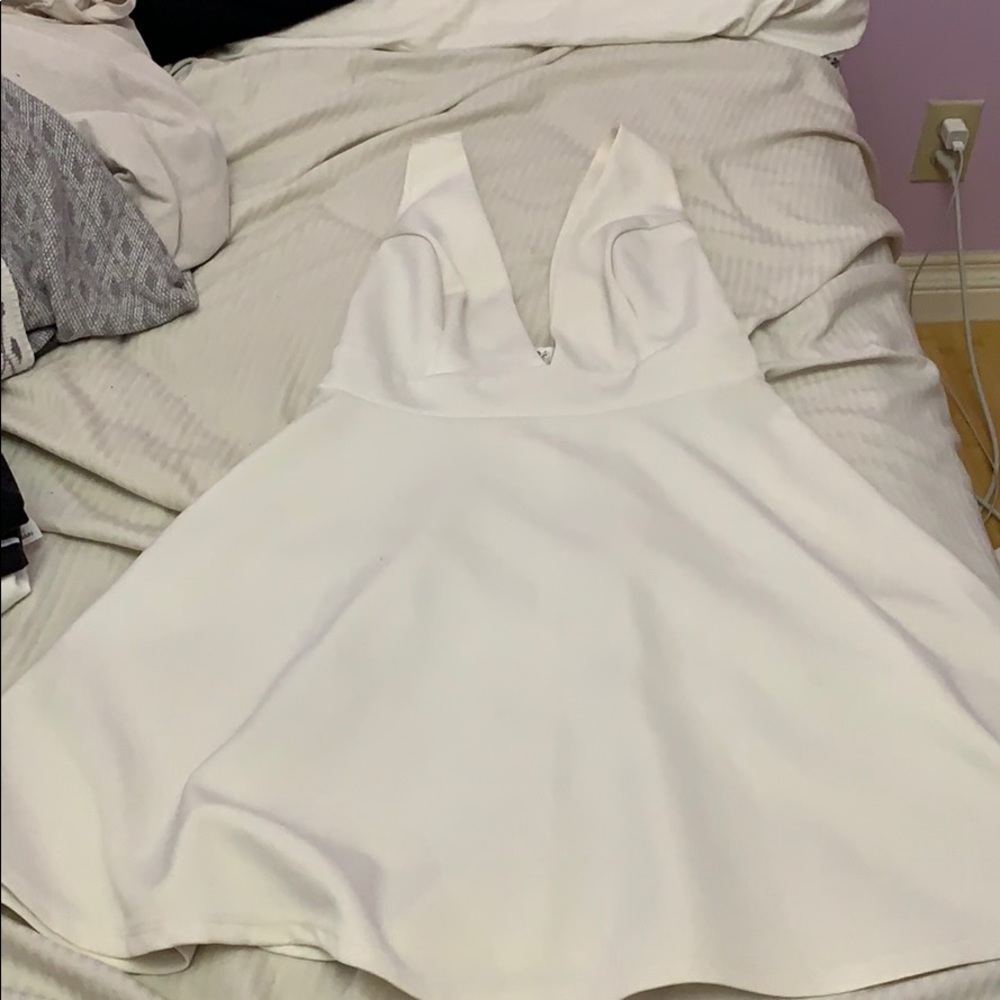 Deep V white mini dress